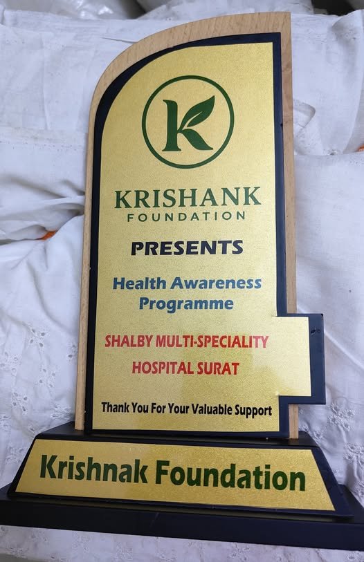 Recognition trophy presented to Krishank Foundation by Shalby Multi-Speciality Hospital, Surat