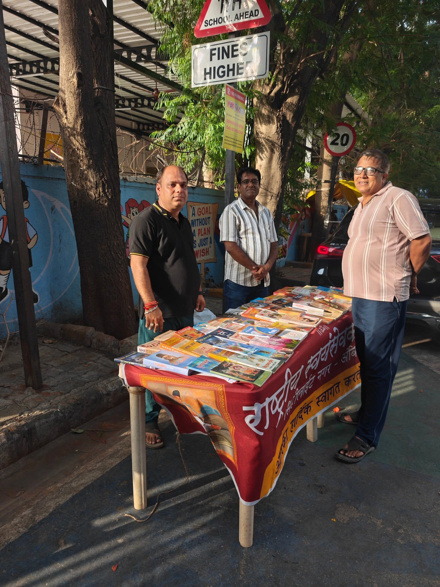 Volunteers at a community book donation stall in Surat